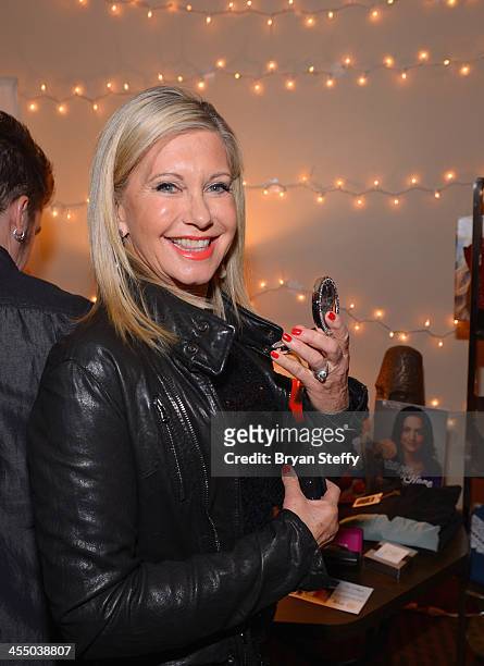 Singer Olivia Newton-John attends the Backstage Creations Celebrity Retreat at the American Country Awards 2013 at the Mandalay Bay Events Center on...
