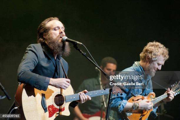 Sam Beam and Glen Hansard perform on stage with Calexico for Holiday Cheer For FUV 2013 at Beacon Theatre on December 10, 2013 in New York, New York.