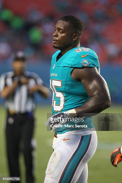 Dion Jordon of the Miami Dolphins plays against the St. Louis Rams during a preseason game at Sun Life Stadium on August 28, 2014 in Miami Gardens,...