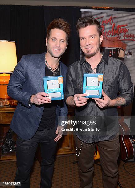 Musicians Scott Thomas and Josh McSwain of Parmalee attend the Backstage Creations Celebrity Retreat at the American Country Awards 2013 at the...