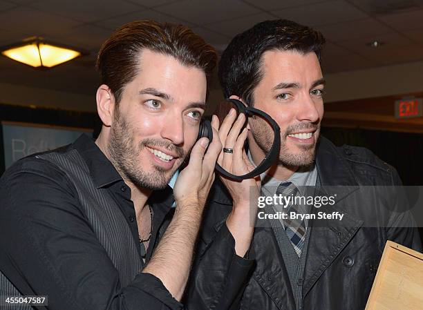 Television personalities Jonathan Scott and Drew Scott attend the Backstage Creations Celebrity Retreat at the American Country Awards 2013 at the...