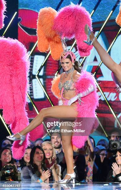 Driver Danica Patrick performs dressed as a showgirl from the "Jubilee!" show as she co-hosts the American Country Awards 2013 at the Mandalay Bay...