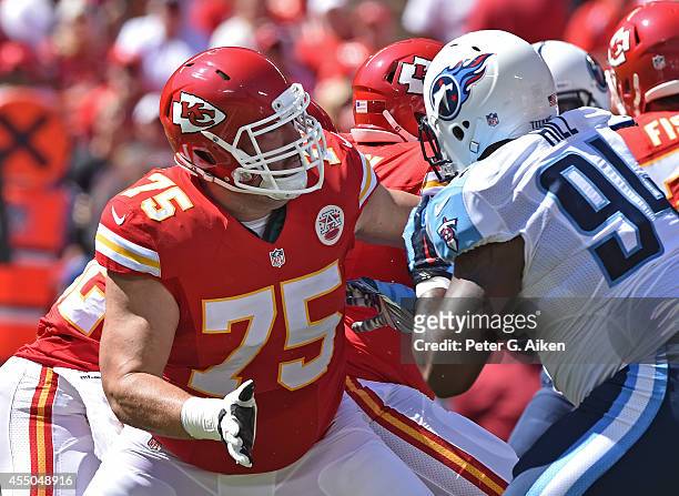 Offensive guard Mike McGlynn of the Kansas City Chiefs blocks nose tackle Sammie Hill of the Tennessee Titans during the second half on September 7,...