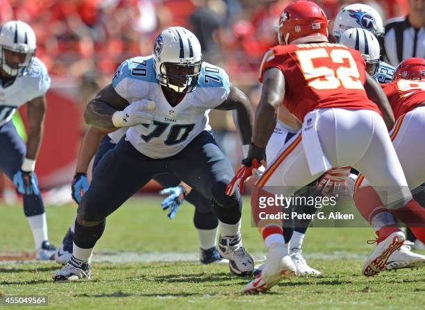 Offensive guard Chance Warmack of the Tennessee Titans gets set to block linebacker James-Michael Johnson of the Kansas City Chiefs during the first...