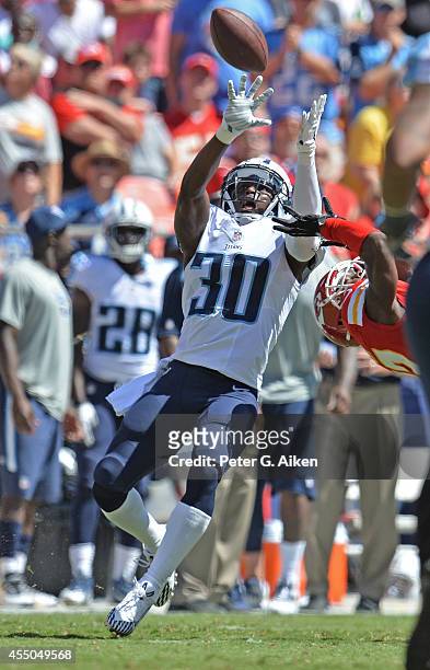 Defensive back Jason McCourty of the Tennessee Titans makes an interception against the Kansas City Chiefs during the first half on September 7, 2014...