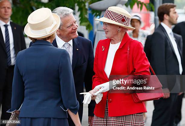 German President Joachim Gauck welcomes Queen Margrethe II of Denmark upon their arrival to board the remake of a Viking ship on September 9, 2014 in...
