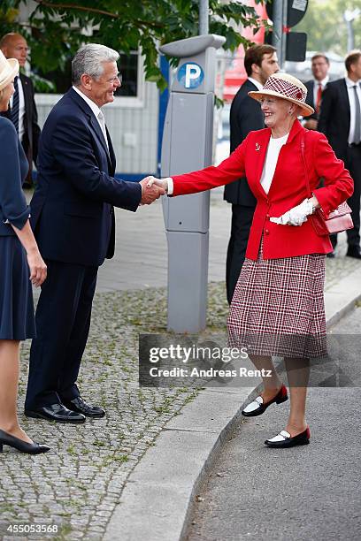 German President Joachim Gauck welcomes Queen Margrethe II of Denmark upon their arrival to board the remake of a Viking ship on September 9, 2014 in...