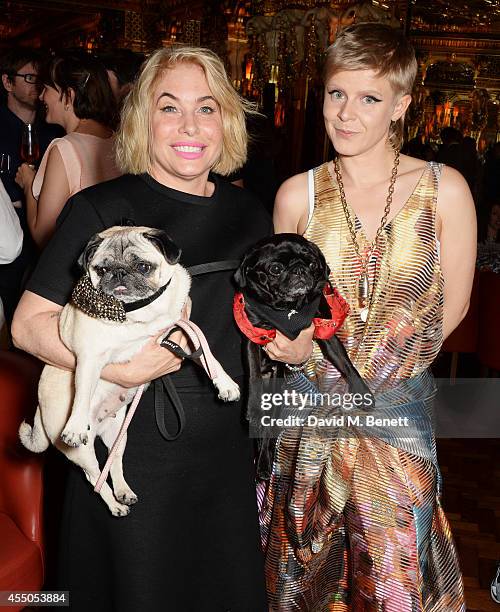 Brix Smith-Start and Robyn pose with dogs Pixie and Gladys at 'The Gentlewoman' issue launch party at the Oscar Wilde Bar at The Club at Cafe Royal...