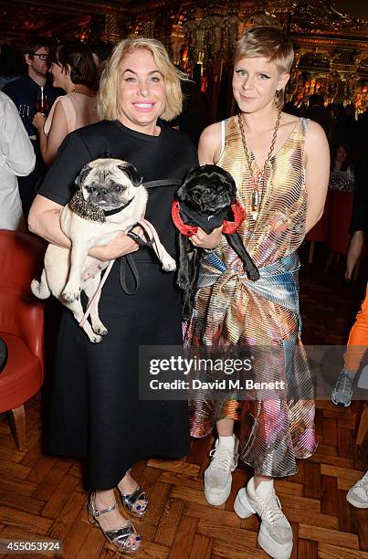 Brix Smith-Start and Robyn pose with dogs Pixie and Gladys at 'The Gentlewoman' issue launch party at the Oscar Wilde Bar at The Club at Cafe Royal...