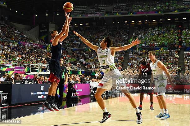 Stephen Curry of the USA Basketball Men's National Team shoots against Domen Lorbek of the Slovenia Basketball Men's National Team during 2014 FIBA...