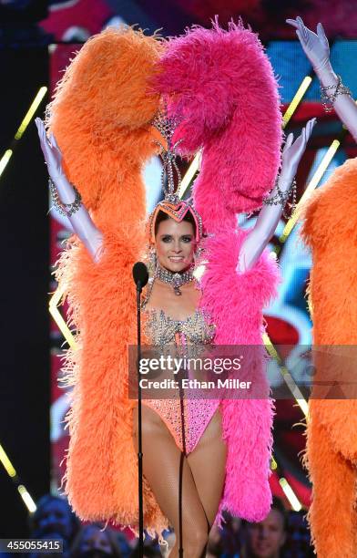 Driver Danica Patrick performs dressed as a showgirl from the "Jubilee!" show as she co-hosts the American Country Awards 2013 at the Mandalay Bay...