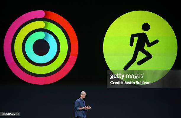 Apple CEO Tim Cook announces fitness apps for the new iPhone 6 and Apple Watch during an Apple special event at the Flint Center for the Performing...