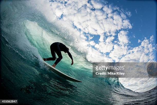 down the line with clouds - surfer australia stock-fotos und bilder