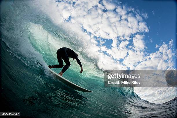 down the line with clouds - surfer wave stock pictures, royalty-free photos & images