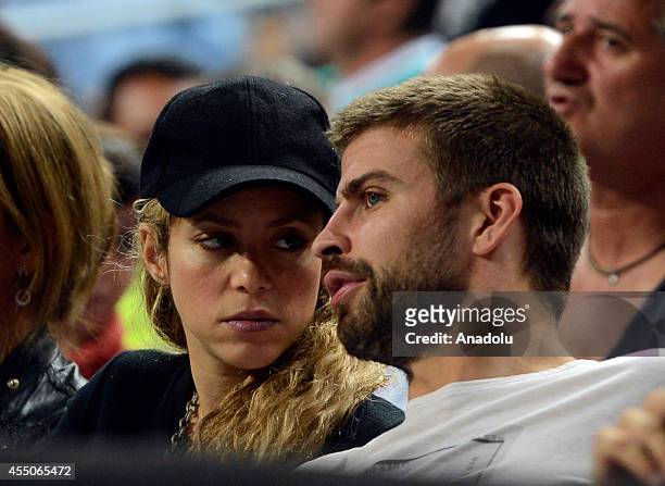 Gerard Pique of Barcelona and his wife Colombian singer Shakira attend the 2014 FIBA Basketball World Cup quarter final match between Slovenia and...