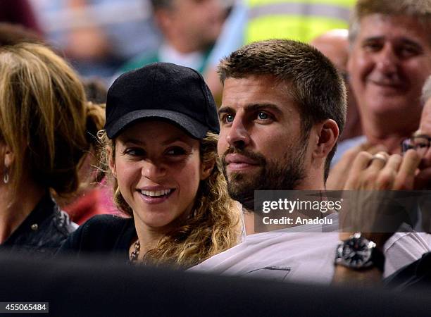 Gerard Pique of Barcelona and his wife Colombian singer Shakira attend the 2014 FIBA Basketball World Cup quarter final match between Slovenia and...