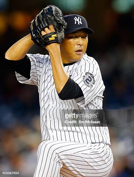 Hiroki Kuroda of the New York Yankees pitches in the first inning against the Tampa Bay Rays at Yankee Stadium on September 9, 2014 in the Bronx...