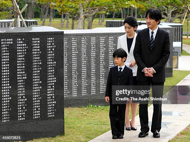 Prince Hisahito , Prince Akishino and Princess Kiko of Akishino visit the Heiwa-no-Ishiji, at Mabuni-no-Oka, Peace Memorial Park on December 10, 2013...