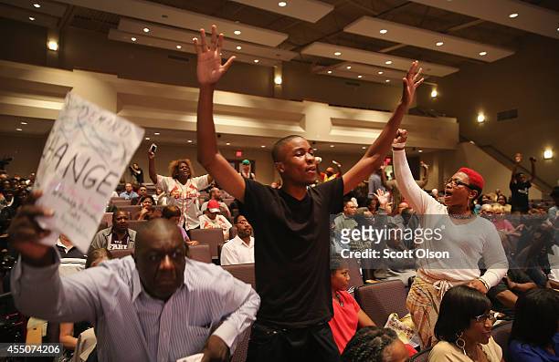Residents shout out during the Ferguson city council meeting on September 9, 2014 in Ferguson, Missouri. The meeting was held at Greater Grace Church...