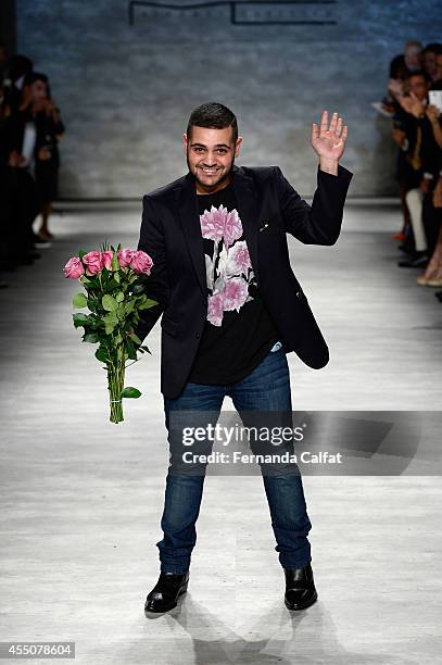Designer Michael Costello walks the runway at the Michael Costello fashion show during Mercedes-Benz Fashion Week Spring 2015 at The Pavilion at...