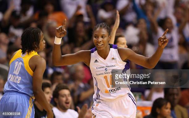 Eshaya Murphy of the Phoenix Mercury reacts after hitting a three point shot past Epiphanny Prince of the Chicago Sky during the second half of game...