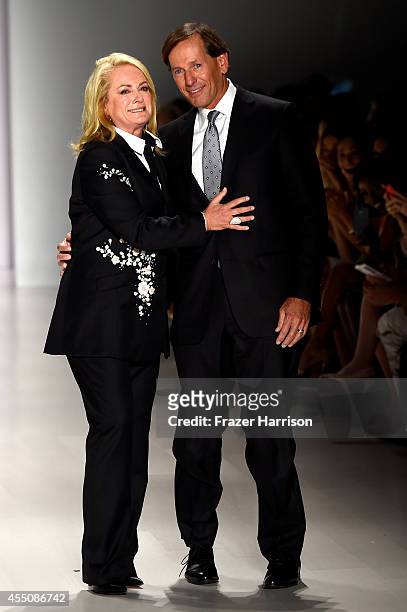 Designer Pamella Roland and her husband Daniel DeVos walk the runway at the Pamella Roland fashion show during Mercedes-Benz Fashion Week Spring 2015...