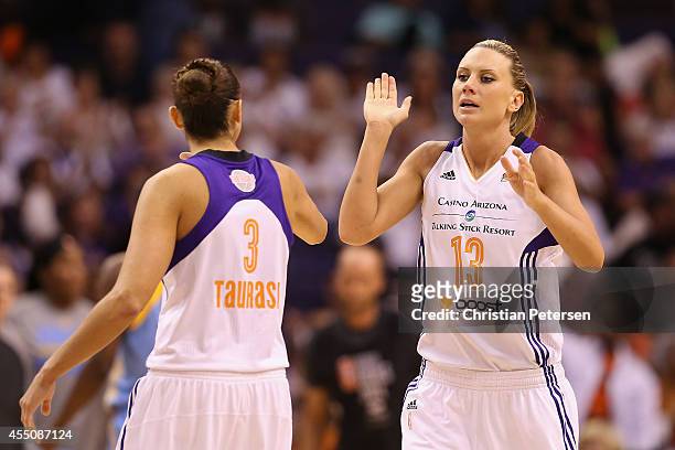 Penny Taylor of the Phoenix Mercury high-fives Diana Taurasi after scoring against the Chicago Sky during the second half of game two of the WNBA...