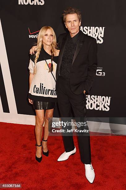 Designer Gela Nash and John Taylor of Duran Duran attend Fashion Rocks 2014 at the Barclays Center on September 9, 2014 in New York City.