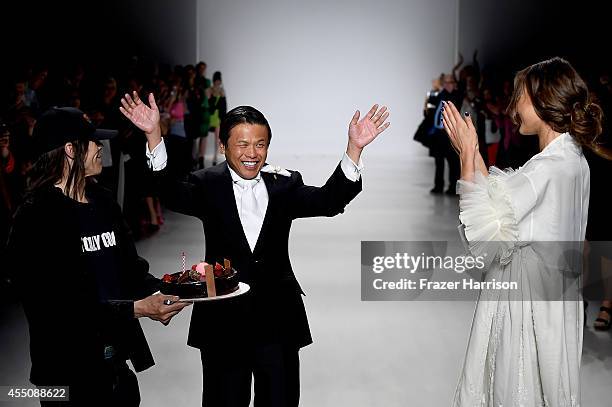 Fashion designer Zang Toi walks the runway at the Zang Toi fashion show during Mercedes-Benz Fashion Week Spring 2015 at Lincoln Center on September...