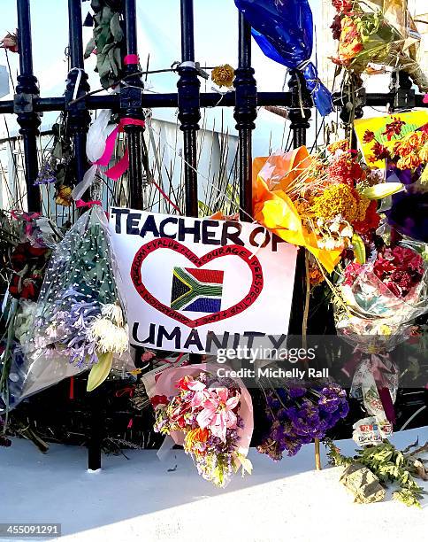 Flowers and messages for late South African President Nelson Mandela adorn the entrance to the South African Parliament Building on December 10, 2013...