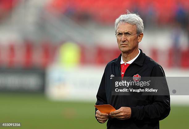 Head Coach of Canada Benito Floro looks on during warmup for the International Friendly match between Canada and Jamaica at BMO Field on September...