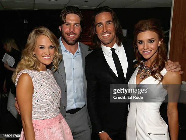 Carrie Underwood, Mike Fischer, Jake Owen, and Lacey Buchanan pause for a photo backstage at the 8th Annual ACM Honors at the Ryman Auditorium on...
