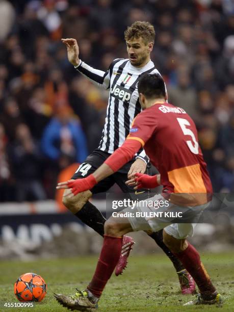 Galatasaray's Gokhan Zan challenges Juventus' Fernando Leiorente during the UEFA Champions League group B football match between Galatasaray and...