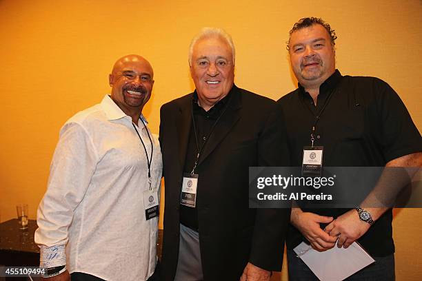 Former National Hockey League stadouts Grant Fuhr and Chris Kotsopolis flank National Hockey League Hall of Famer Phil Esposito when they attend the...