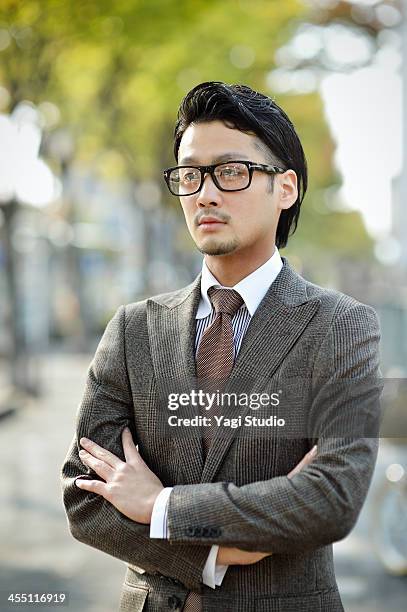 young businessman in town - brown suit stock pictures, royalty-free photos & images