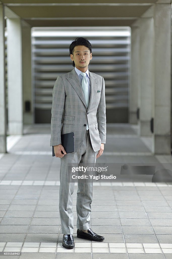 Businessman standing with digital tablet