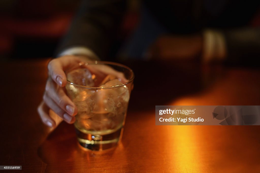 Man enjoying a drink at the bar