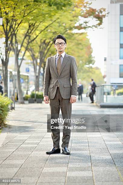 young businessman in town - beige suit stock pictures, royalty-free photos & images