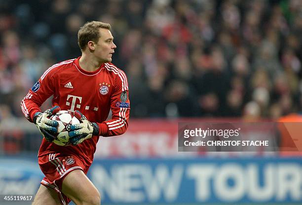 Bayern Munich's goalkeeper Manuel Neuer plays the ball during the UEFA Champions League group D match between German first division Bundesliga...