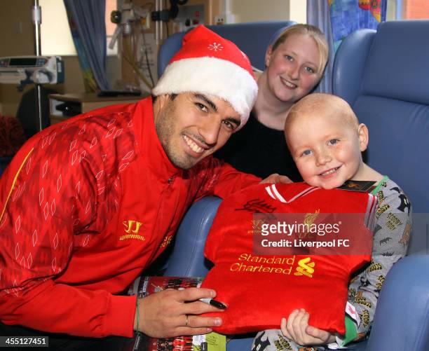 Luis Suarez of Liverpool FC visits patients at Alder Hey Children's Hospital on December 11, 2013 in Liverpool, England.