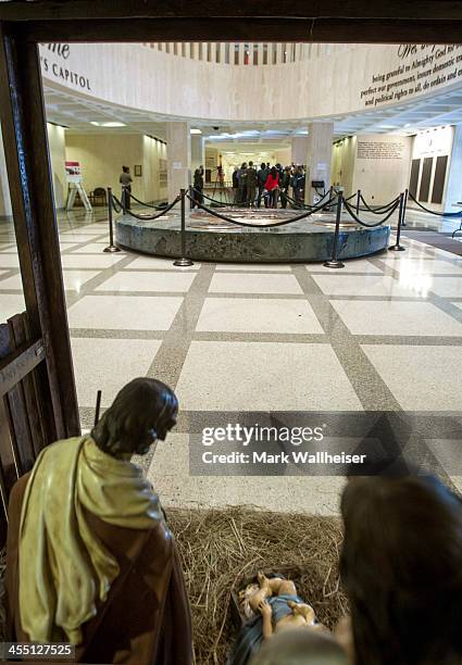Religious Christian Nativity manger sits in the foreground as the media assembles around Chaz Stevens from Deerfield Beach, Florida and his Festivus...