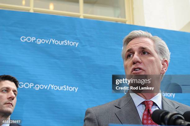 Rep. Kevin McCarthy offers remarks as Chairman of the House Budget Committee Rep. Paul Ryan looks on during a media availability following a...
