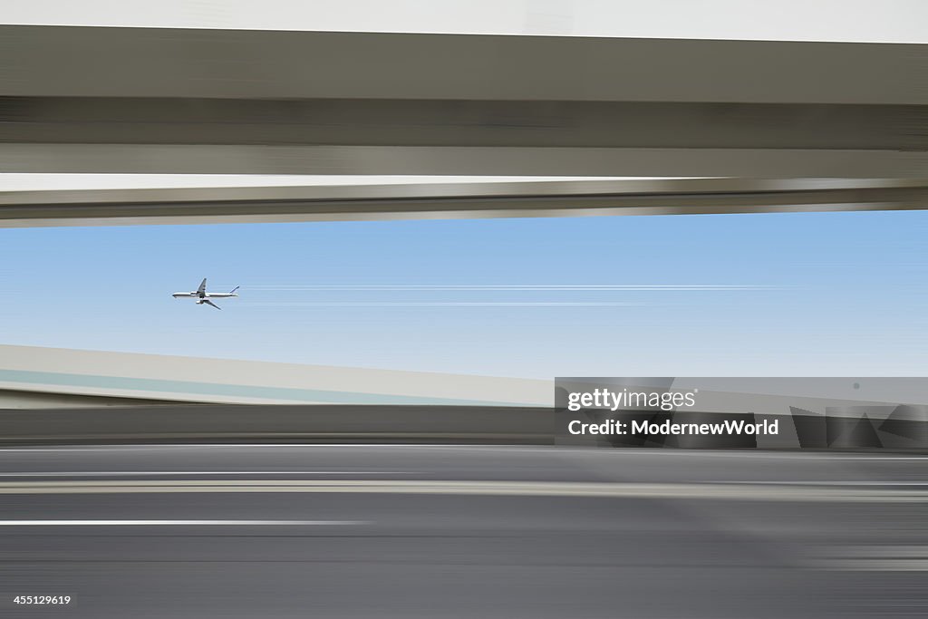 Airplane flying over the highway