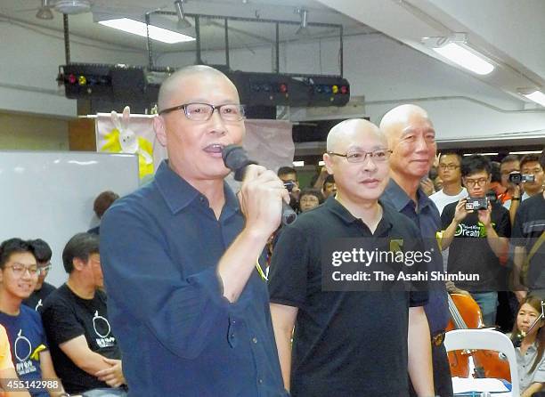 Leaders of the 'Occupy Central' movement Chan Kin-man, Benny Tai and Chu Yiu-ming speak after shaving their heads in protest against Beijing's...
