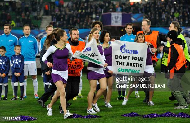 Greenpeace activicts demonstrate prior to the UEFA Champions League group G football match FK Austria Wien vs FC Zenit in Vienna, Austria, on...