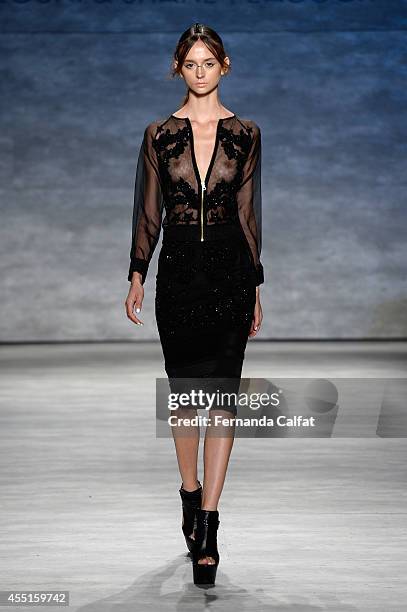 Model walks the runway at the Falguni and Shane Peacock fashion show during Mercedes-Benz Fashion Week Spring at The Pavilion at Lincoln Center on...