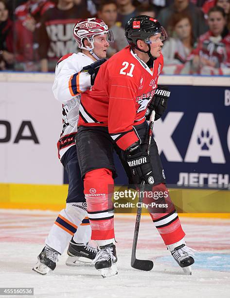 Richard Jencik of HC Kosice and John Tripp of Koelner Haie during the Champions Hockey League game between Koelner Haie and HC Kosice on August 21,...