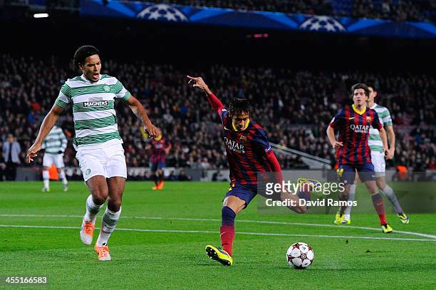 Neymar of FC Barcelona shoots towards goal under a challenge by Virgil van Dijk of Celtic FC during the UEFA Champions League Group H match between...