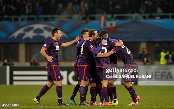 Austria Wien's players celebrate after scoring the 1-1 during the UEFA Champions League group G football match FK Austria Wien vs FC Zenit in Vienna,...