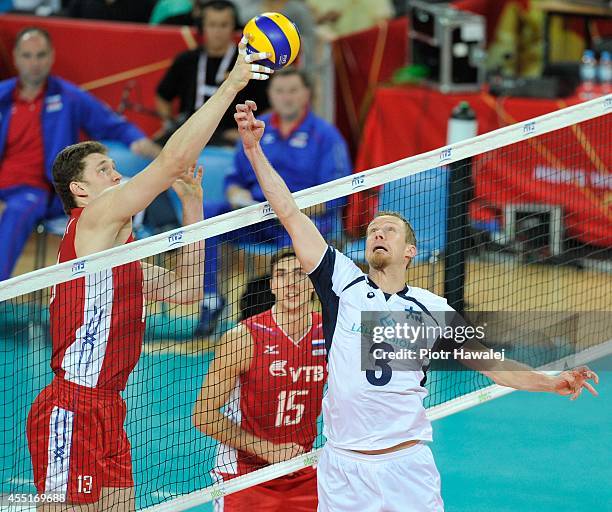 Dmitriy Muserskiy of Russia defends against Mikko Esko of Finland during the FIVB World Championships match between Finland and Russia on September...